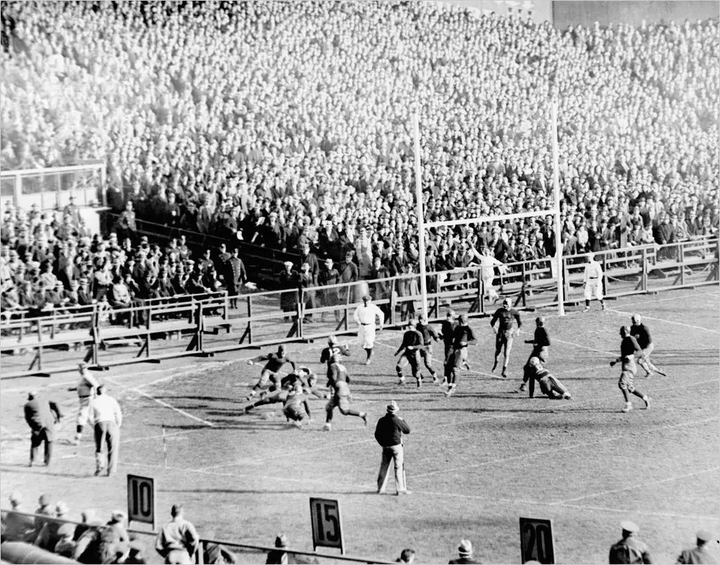 Jack Buckler scores for Army against Notre Dame at Yankee Stadium on Dec. 2, 1933. The Cadets were undefeated heading into the game, but lost 13-12 when the Irish blocked an Army punt in the final minute and recovered the ball in the end zone.Credit...Associated Press