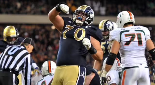 Notre Dame Fighting Irish offensive tackle Zack Martin (70) celebrates after running back Cierre Wood (20), not shown, scored a touchdown in the third quarter against the Miami Hurricanes at Soldier Field. Notre Dame won 41-3. (Photo: Matt Cashore / US PRESSWIRE)