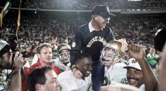Jan 1, 1990; Miami, FL, USA; FILE PHOTO; Notre Dame Irish head coach Lou Holtz is carried off the field following their victory over Colorado in the Orange Bowl. Mandatory Credit: Photo By USA TODAY Sports © Copyright USA TODAY Sports